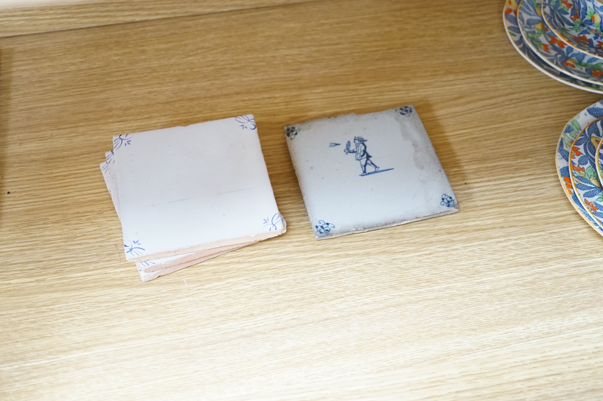 From the Studio of Fred Cuming. A group of tiles, mostly 19th / 20th century Delft, largest 23 x 23cm. Condition - fair